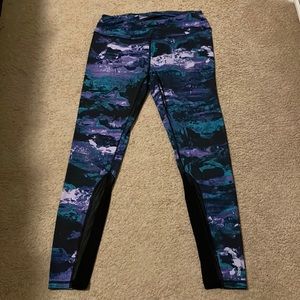 Women’s fun patterned Reebok leggings with mesh cutout